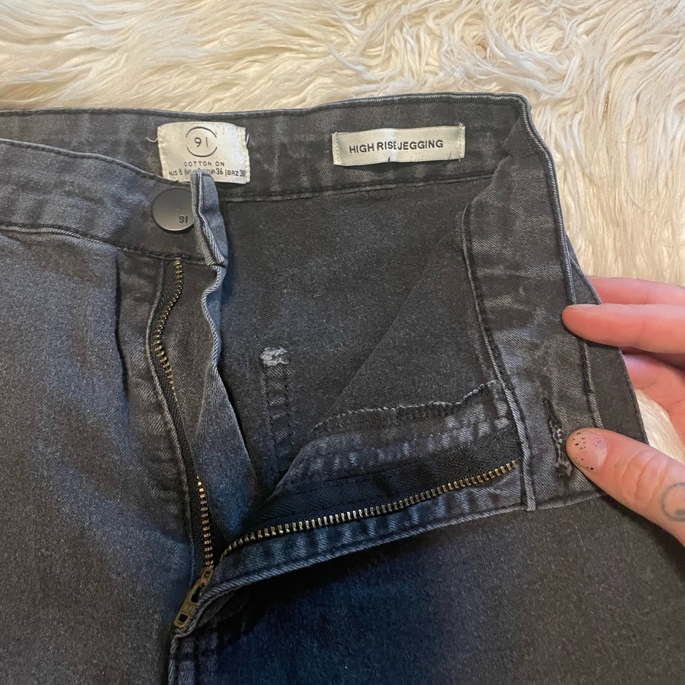 High rise black ripped skinnies